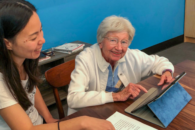 senior woman taking classes on ipad learning how to use technology for seniors
