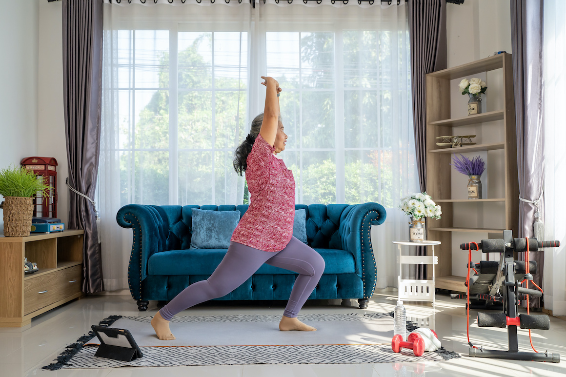 Retirement woman doing exercise at home during quarantine