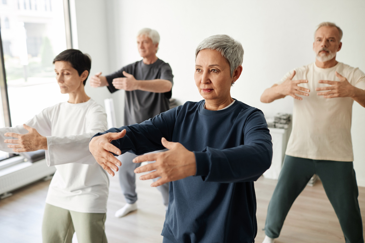 qigong class participants AdobeStock_693058759