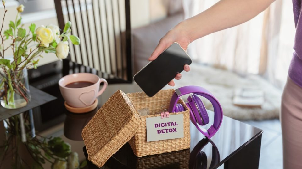 Mobile phone being put away in a box.