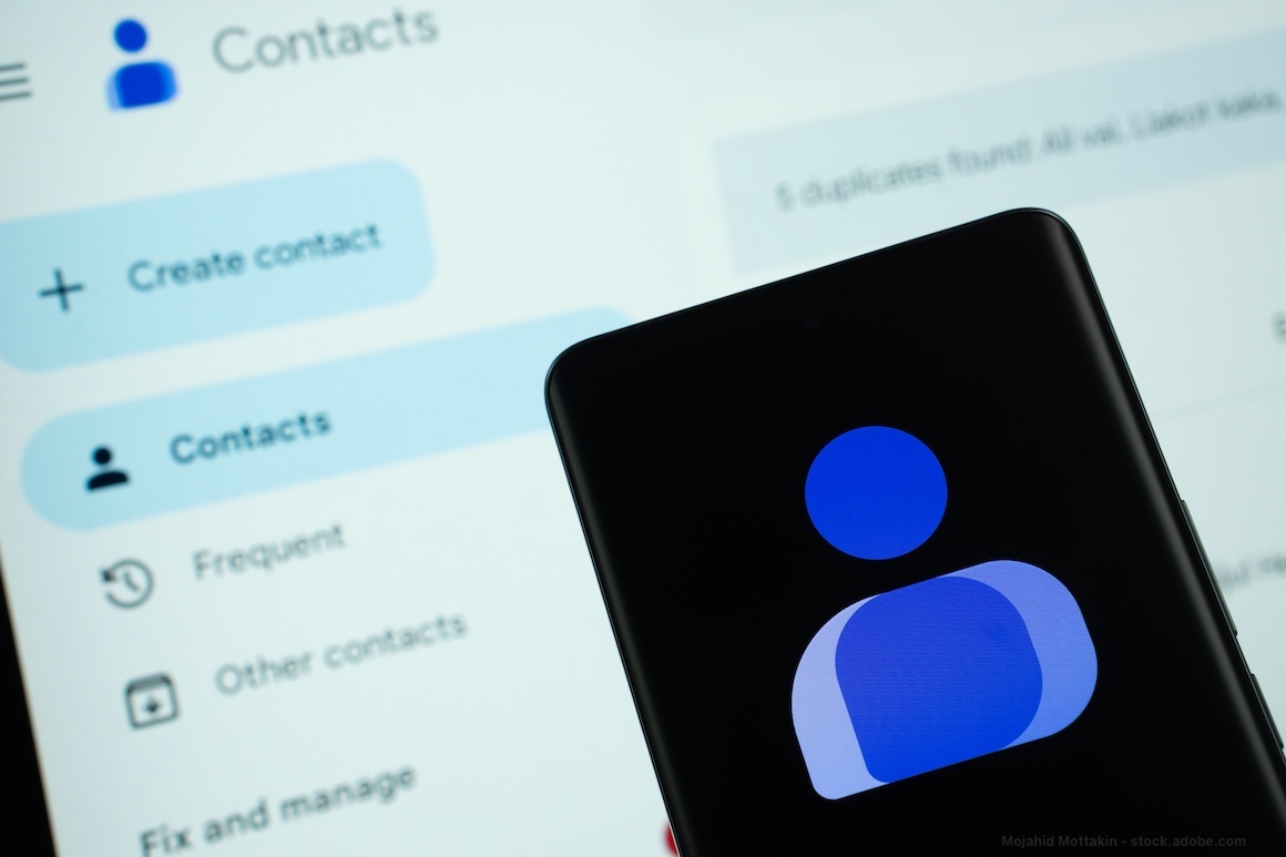 Dhaka, Bangladesh – 16 March 2025: The logo of the Google contacts is displayed on a smartphone screen, and the website google contacts is visible on a computer screen in the background.