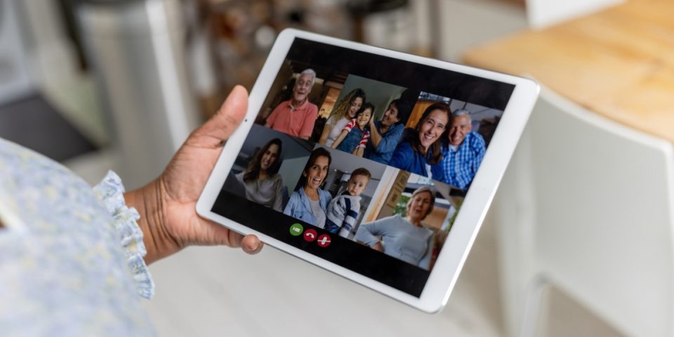 Family on a tablet screen on a video call.