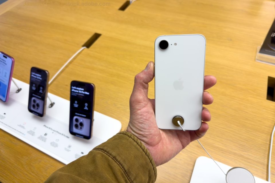 Holding new Apple iPhone 16e inside a retail store.